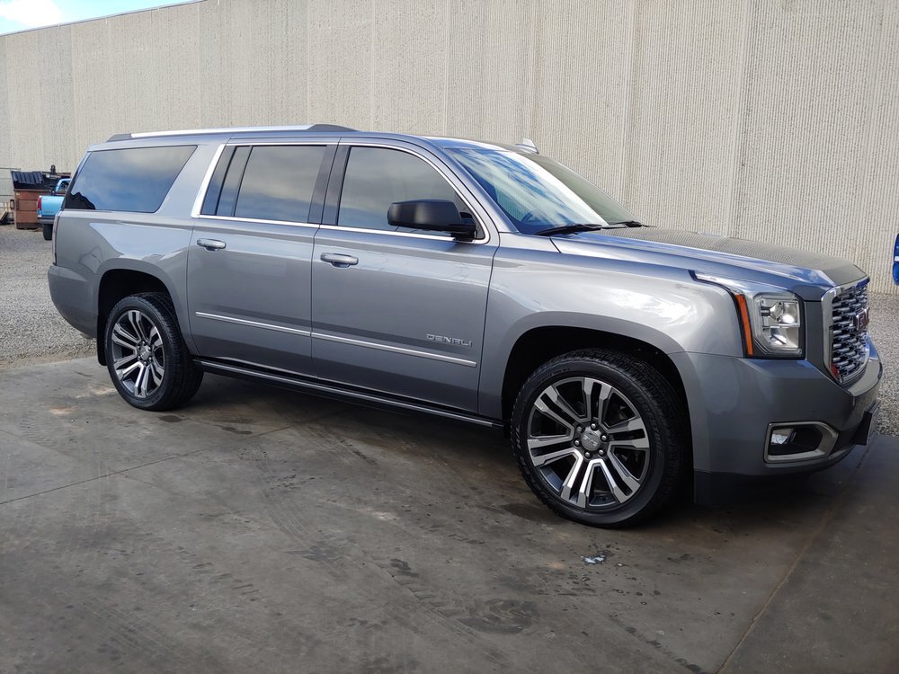 GMC Yukon XL Denali in metallic gray with polished paint